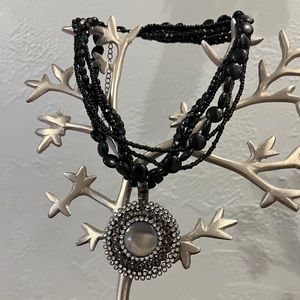 Two-piece black beaded necklace with clip on pendant